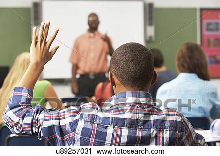 Male Pupil Raising Hand In Class View Large Photo Image Stock Image - Male Pupil Raising Hand In Class. Fotosearch