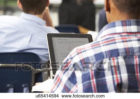 Male Pupil Using Digital Tablet In Classroom View Large Photo Image Picture - Male Pupil Using Digital Tablet In Classroom. Fotosearch