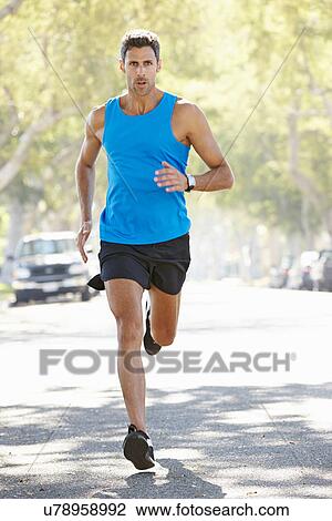 Male Runner Exercising On Suburban Street View Large Photo Image Stock Image - Male Runner Exercising On Suburban Street. Fotosearch