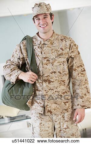 Stock Image - Male Soldier With Kit Bag Home For Leave. Fotosearch
