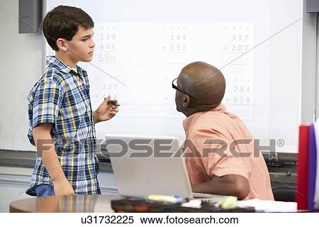 Male Student Writing Answer On Whiteboard View Large Photo Image Stock Photography - Male Student Writing Answer On Whiteboard. Fotosearch