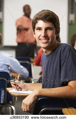 Male Teenage Pupil In Classroom View Large Photo Image Stock Image - Male Teenage Pupil In Classroom. Fotosearch