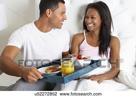 Man Bringing Woman Breakfast In Bed On Tray View Large Photo Image Stock Image - Man Bringing Woman Breakfast In Bed On Tray. Fotosearch