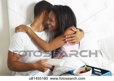 Man Bringing Woman Breakfast In Bed On Celebration Day View Large Photo Image Stock Image - Man Bringing Woman Breakfast In Bed On Celebration Day. Fotosearch