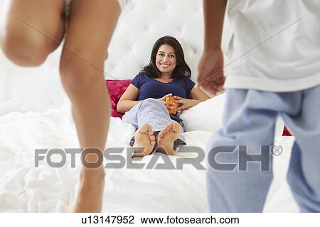 Mother And Children Relaxing In Bed Wearing Pajamas View Large Photo Image Stock Image - Mother And Children Relaxing In Bed Wearing Pajamas. Fotosearch