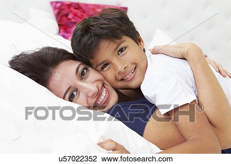 Mother And Son Lying In Bed Together View Large Photo Image Stock Image - Mother And Son Lying In Bed Together. Fotosearch