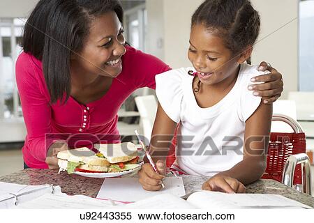 Mother Brings Daughter Sandwich Whilst She Studies View Large Photo Image Stock Photography - Mother Brings Daughter Sandwich Whilst She Studies. Fotosearch