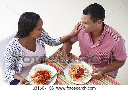 Overhead View Of Couple Eating Meal Together View Large Photo Image Stock Photograph - Overhead View Of Couple Eating Meal Together. Fotosearch