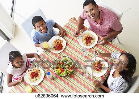Overhead View Of Family Eating Meal Together View Large Photo Image Picture - Overhead View Of Family Eating Meal Together. Fotosearch