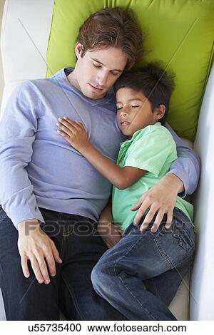 Overhead View Of Father And Son Relaxing On Sofa View Large Photo Image Stock Image - Overhead View Of Father And Son Relaxing On Sofa. Fotosearch
