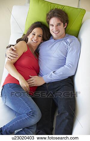 Overhead View Of Man Relaxing On Sofa With Pregnant Wife View Large Photo Image Stock Image - Overhead View Of Man Relaxing On Sofa With Pregnant Wife . Fotosearch