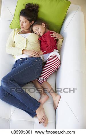 Overhead View Of Mother And Daughter Relaxing On Sofa View Large Photo Image Stock Image - Overhead View Of Mother And Daughter Relaxing On Sofa. Fotosearch