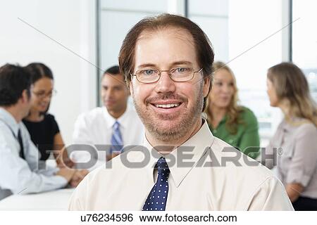 Portrait Of Businessman Sitting At Boardroom Table View Large Photo Image Stock Photograph - Portrait Of Businessman Sitting At Boardroom Table. Fotosearch