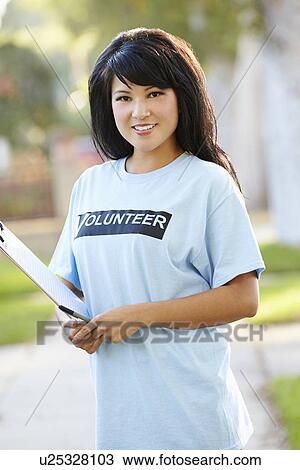 Stock Image - Portrait Of Charity Volunteer On Street. Fotosearch