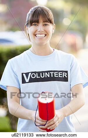 Portrait Of Charity Volunteer On Street With Collection Tin View Large Photo Image Stock Image - Portrait Of Charity Volunteer On Street With Collection Tin. Fotosearch