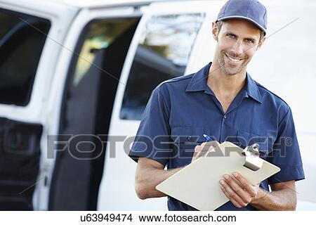 Picture - Portrait Of Delivery Driver With Clipboard. Fotosearch