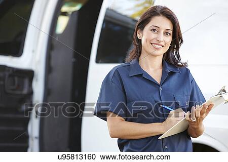 Stock Image - Portrait Of Female Delivery Driver With Clipboard. Fotosearch