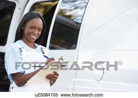 Stock Photography - Portrait Of Female Repair Person With Van. Fotosearch