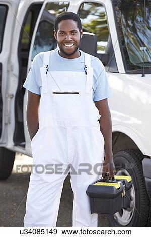 Stock Photo - Portrait Of Repairman With Van. Fotosearch