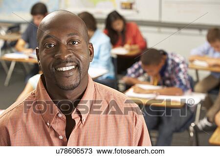 Portrait Of Teacher In Classroom View Large Photo Image Stock Image - Portrait Of Teacher In Classroom. Fotosearch