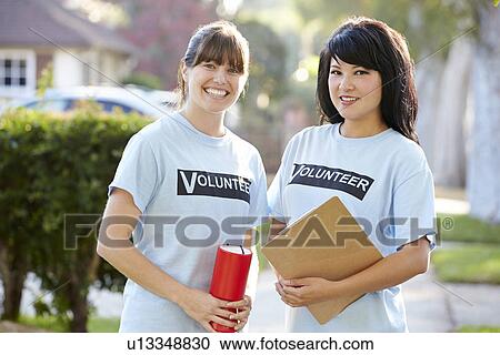 Portrait Of Two Female Charity Volunteers On Street View Large Photo Image Stock Image - Portrait Of Two Female Charity Volunteers On Street. Fotosearch