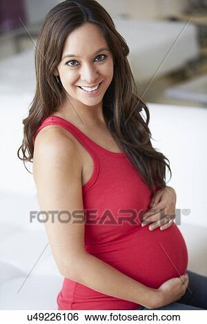 Pregnant Woman Sitting On Sofa View Large Photo Image Stock Photograph - Pregnant Woman Sitting On Sofa. Fotosearch