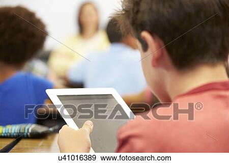 Pupil In Class Using Digital Tablet View Large Photo Image Stock Photo - Pupil In Class Using Digital Tablet. Fotosearch