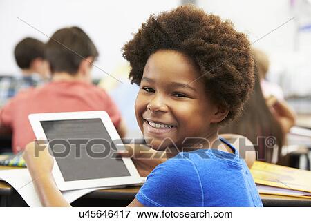 Pupil In Class Using Digital Tablet View Large Photo Image Stock Photo - Pupil In Class Using Digital Tablet. Fotosearch