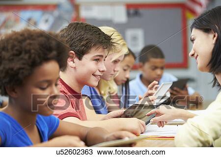Pupils In Class Using Digital Tablet With Teacher View Large Photo Image Stock Image - Pupils In Class Using Digital Tablet With Teacher. Fotosearch