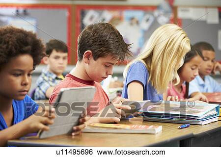 Pupils In Class Using Digital Tablet View Large Photo Image Stock Photograph - Pupils In Class Using Digital Tablet. Fotosearch
