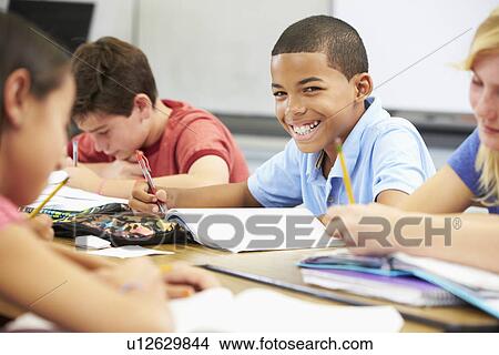 Pupils Studying At Desks In Classroom View Large Photo Image Picture - Pupils Studying At Desks In Classroom. Fotosearch