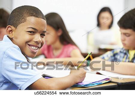 Pupils Studying At Desks In Classroom View Large Photo Image Picture - Pupils Studying At Desks In Classroom. Fotosearch