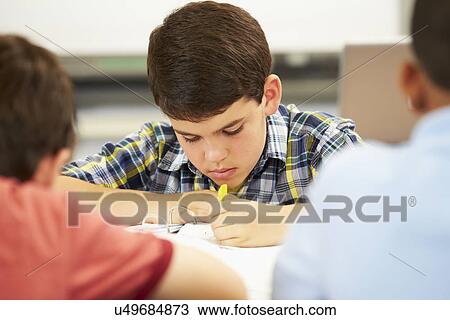 Pupils Studying At Desks In Classroom View Large Photo Image Stock Image - Pupils Studying At Desks In Classroom. Fotosearch