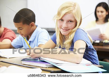 Pupils Studying At Desks In Classroom View Large Photo Image Stock Image - Pupils Studying At Desks In Classroom. Fotosearch