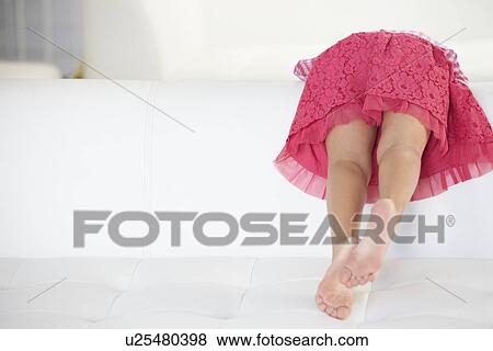 Rear View Of Girl Playing On Sofa View Large Photo Image Stock Photo - Rear View Of Girl Playing On Sofa. Fotosearch