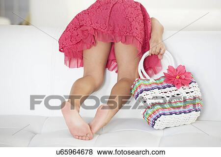 Rear View Of Girl Playing On Sofa View Large Photo Image Stock Photo - Rear View Of Girl Playing On Sofa. Fotosearch