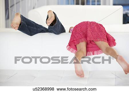 Rear View Of Two Children Playing On Sofa View Large Photo Image Stock Photo - Rear View Of Two Children Playing On Sofa. Fotosearch