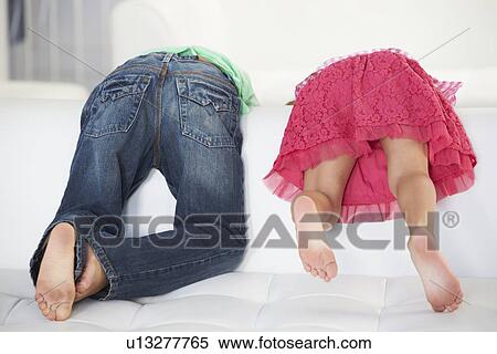 Rear View Of Two Children Playing On Sofa View Large Photo Image Stock Photography - Rear View Of Two Children Playing On Sofa. Fotosearch