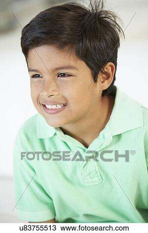 Smiling Boy Sitting On Sofa View Large Photo Image Stock Image - Smiling Boy Sitting On Sofa. Fotosearch