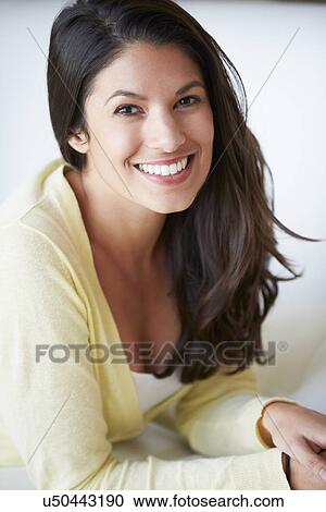 Smiling Woman Sitting On Sofa View Large Photo Image Stock Image - Smiling Woman Sitting On Sofa. Fotosearch