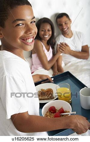 Son Bringing Parents Breakfast In Bed View Large Photo Image Stock Photography - Son Bringing Parents Breakfast In Bed. Fotosearch