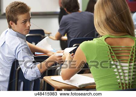 Students Passing Notes In Class View Large Photo Image Stock Image - Students Passing Notes In Class. Fotosearch