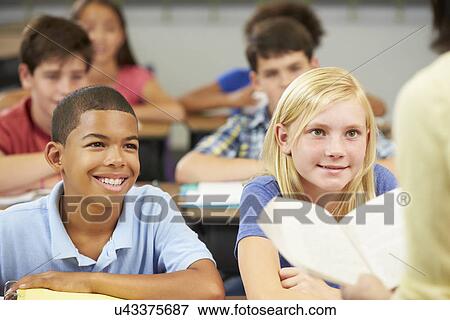 Teacher Reading To Class Of Pupils View Large Photo Image Stock Photo - Teacher Reading To Class Of Pupils. Fotosearch