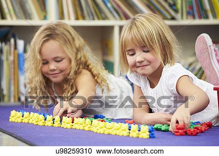 Two Elementary Pupils Counting Together In Classroom View Large Photo Image Stock Image - Two Elementary Pupils Counting Together In Classroom. Fotosearch