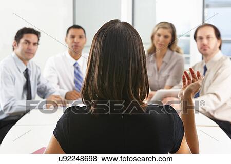 View From Behind As CEO Addresses Meeting In Boardroom View Large Photo Image Stock Photo - View From Behind As CEO Addresses Meeting In Boardroom. Fotosearch