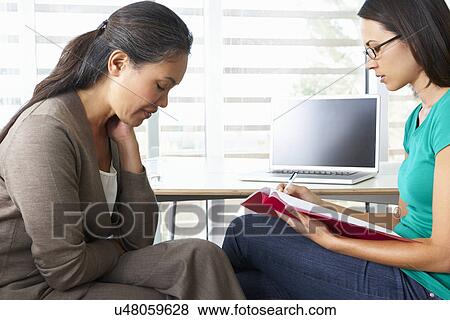 Stock Photo - Woman Having Counselling Session. Fotosearch
