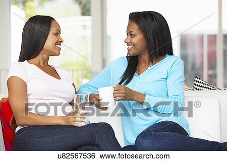 Woman Visiting Pregnant Friend At Home View Large Photo Image Stock Photograph - Woman Visiting Pregnant Friend At Home. Fotosearch