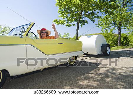 A woman driving a yellow and white Nash Metropolitan; Milford; Michigan; USA View Large Photo Image Stock Photo - A woman driving a yellow and white Nash Metropolitan; Milford; Michigan; USA. Fotosearch