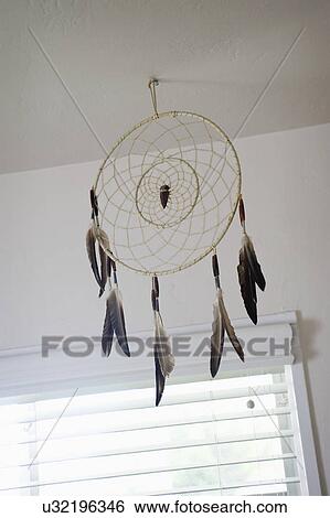 American tribal dreamcatcher hanging on ceiling View Large Photo Image Stock Photograph - American tribal dreamcatcher hanging on ceiling. Fotosearch