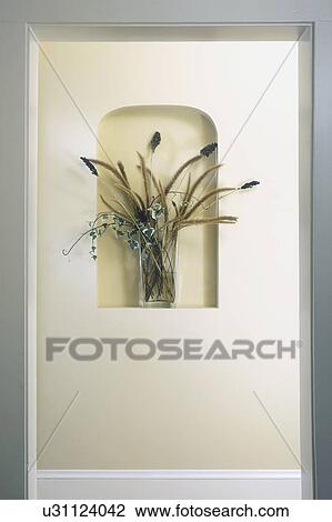 ARCHITECTURAL DETAIL: small niche in wall holds vase of flowers, hallway, close up View Large Photo Image Stock Image - ARCHITECTURAL DETAIL: small niche in wall holds vase of flowers, hallway, close up. Fotosearch